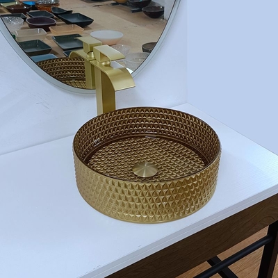 円形の金のガラス容器の流しのダイヤモンドのテーブルの上ボールの洗面器の水晶の浴室