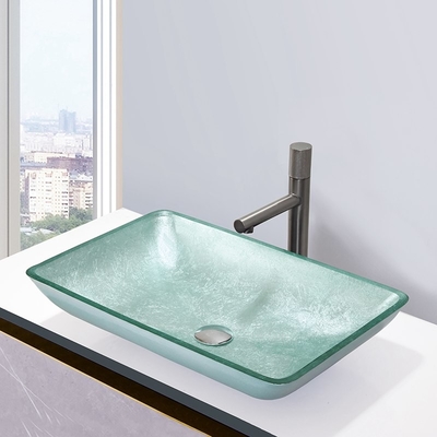銀製の緩和されたBathの洗面器のガラス・ボールの長方形のテーブルの上の固体