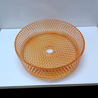 ダイヤモンドの形の水晶の容器の流しのオレンジ カラー テーブルの上の洗面器