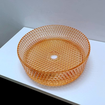 ダイヤモンドの形の水晶の容器の流しのオレンジ カラー テーブルの上の洗面器