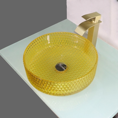 黄色いクリスタル グラスの洗面器の円柱形のカウンタートップの容器の流し