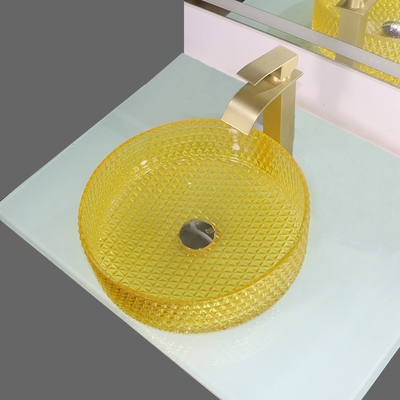 黄色いクリスタル グラスの洗面器の円柱形のカウンタートップの容器の流し