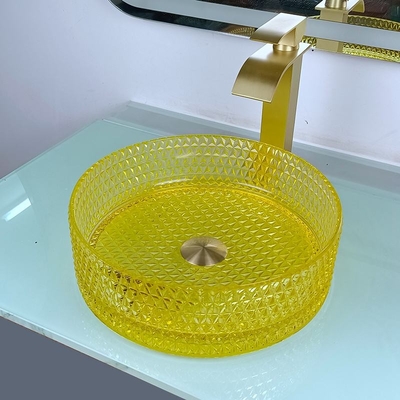 黄色いクリスタル グラスの洗面器の円柱形のカウンタートップの容器の流し