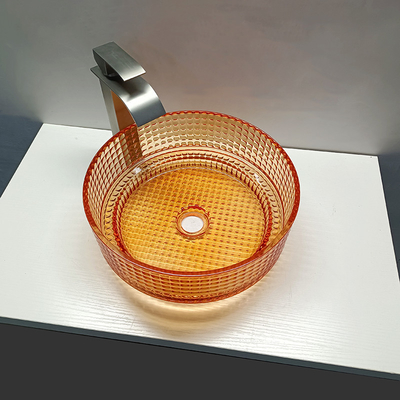 Oranger色のクリスタル グラスの洗面器の飾られた容器のカウンタートップの浴室の流し