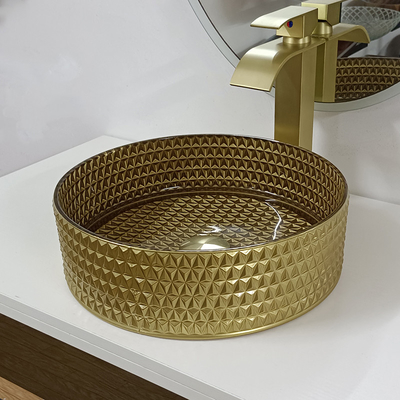 円形の金のガラス容器の流しのダイヤモンドのテーブルの上ボールの洗面器の水晶の浴室